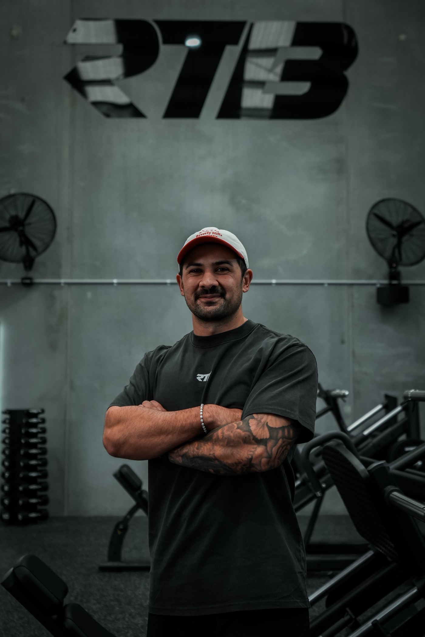 Josh Curry, founder of RTB, in front of the RTB wall